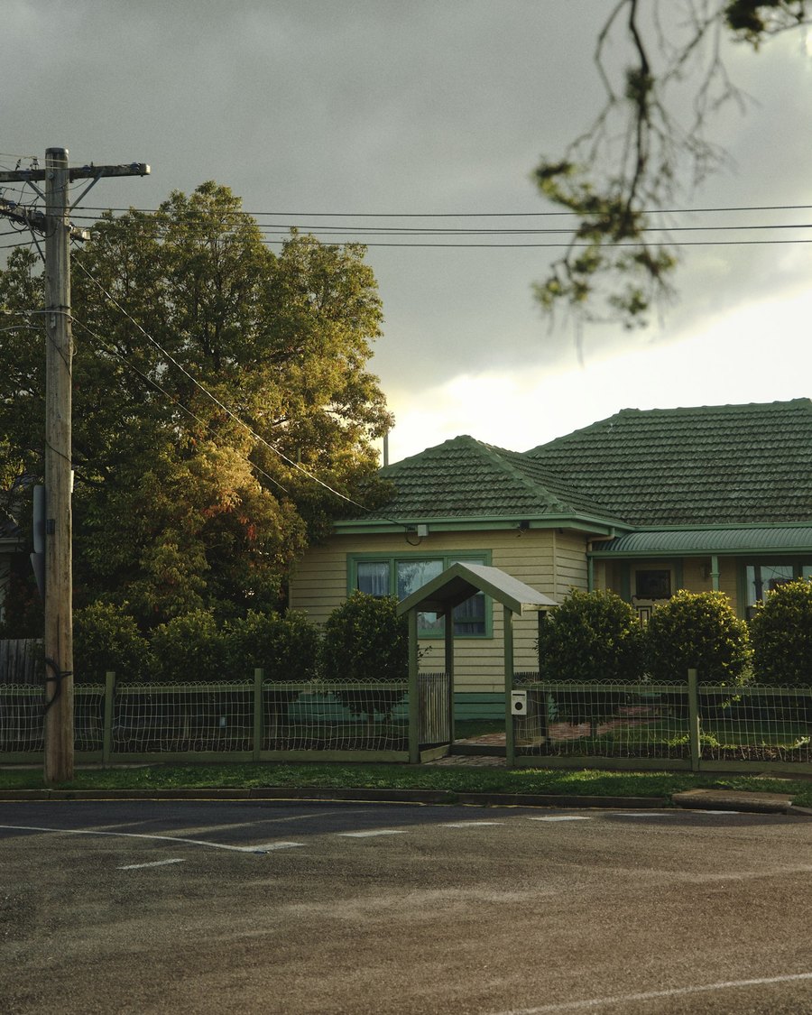 A suburban Melbourne street at dusk, the kind of first home a police officer buys