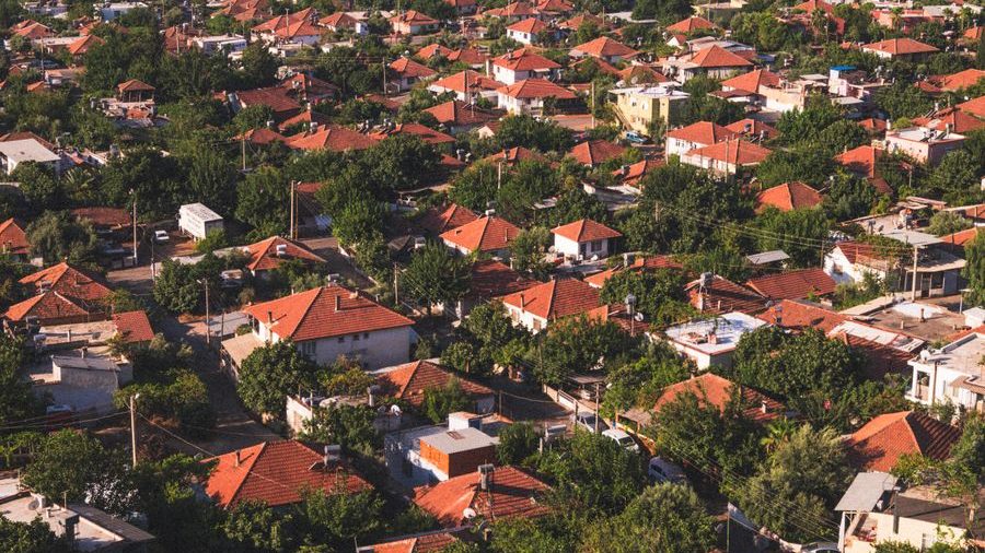An aerial view of a suburban street of family homes