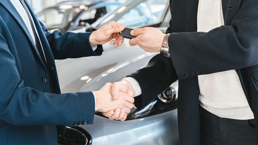 Car keys being handed over